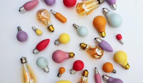 a group of lightbulbs in various colors