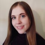 a woman who is smiling and looking at the camera