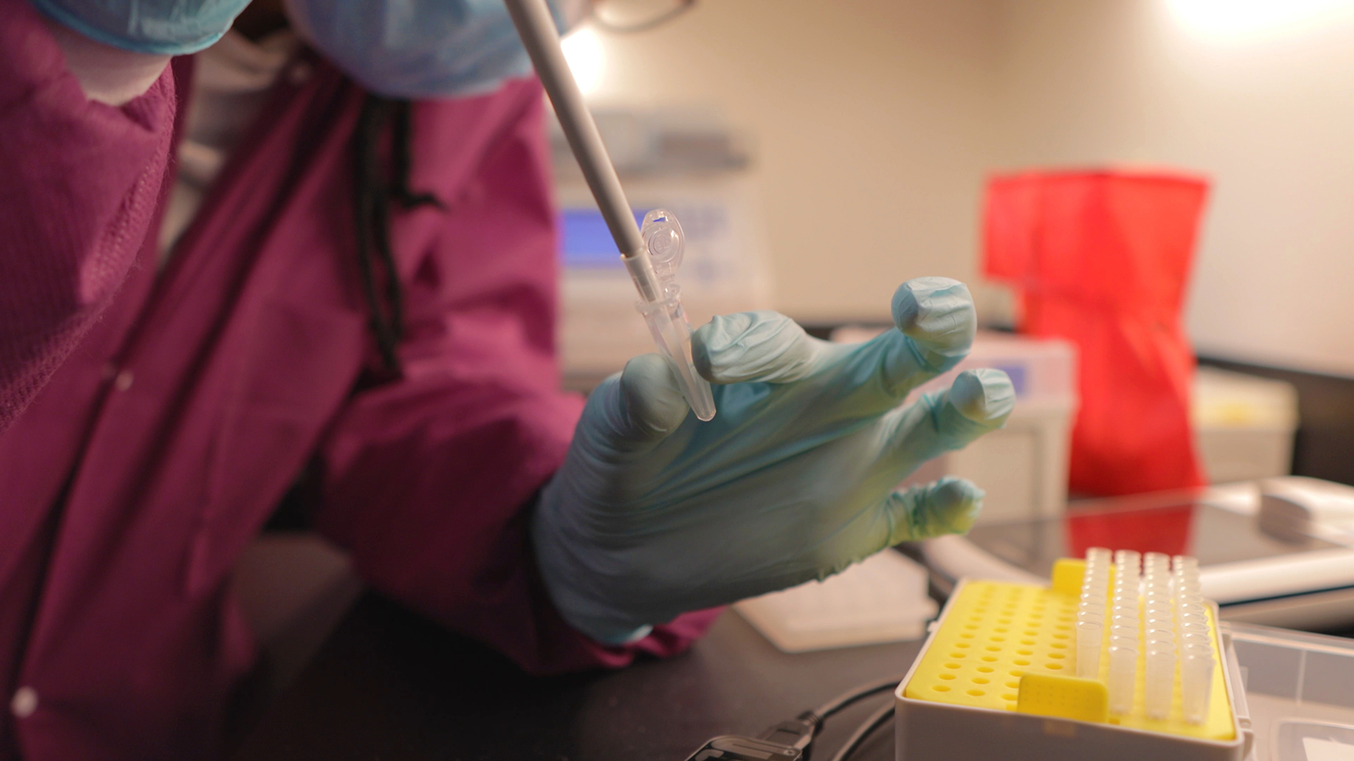 close up photo of a lab technician filling a test tube