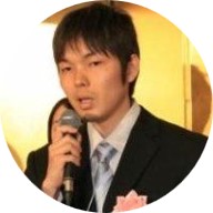 Kenji Kawaguchi in a suit and tie