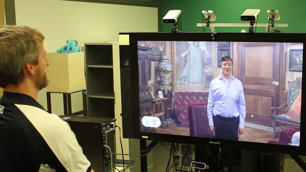 two men facing each other in a video conference using Living Display