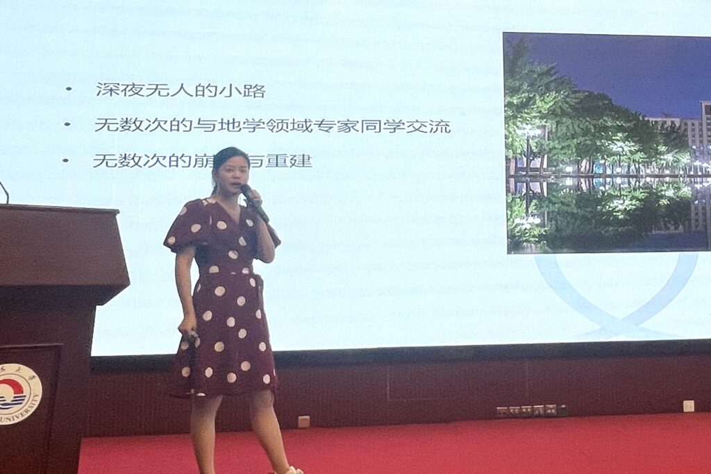 a woman giving a talk