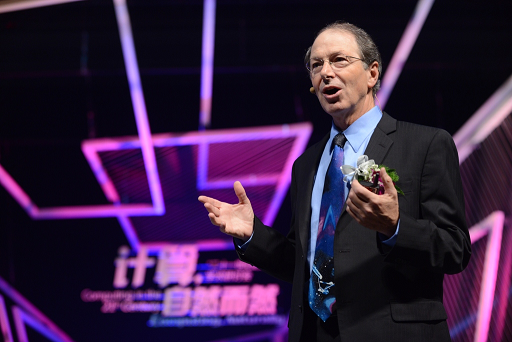 Richard Rashid standing on a stage