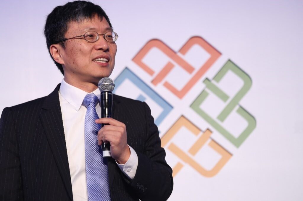 Harry Shum wearing a suit and tie