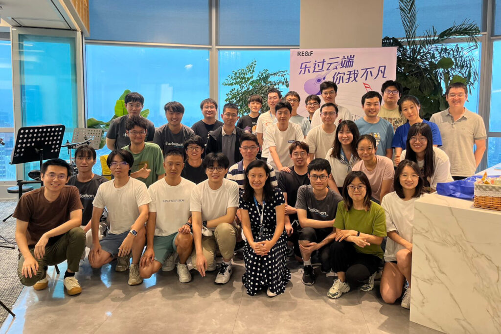 a group of people sitting posing for the camera