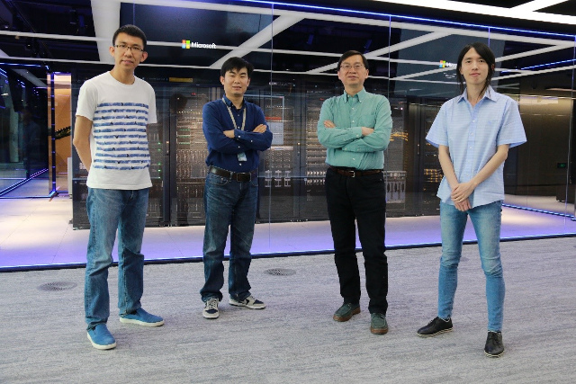 a group of people posing for the camera