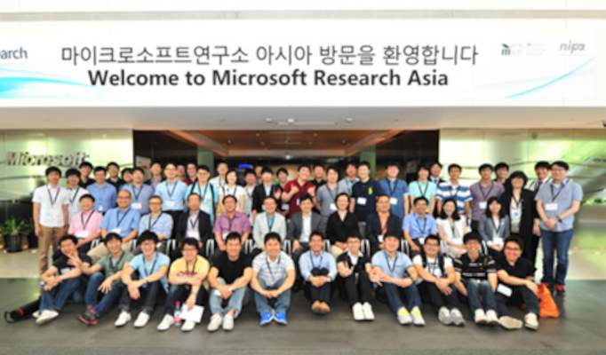 a group of people standing in front of a crowd