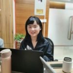 a woman sitting at a table