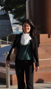 a woman walking down a sidewalk