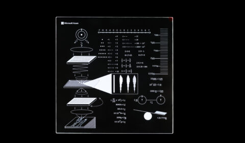 Silica glass platter containing descriptive instructions related to the Avenues Golden Record 2.0 project