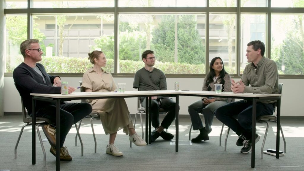 a group of people sitting around a table