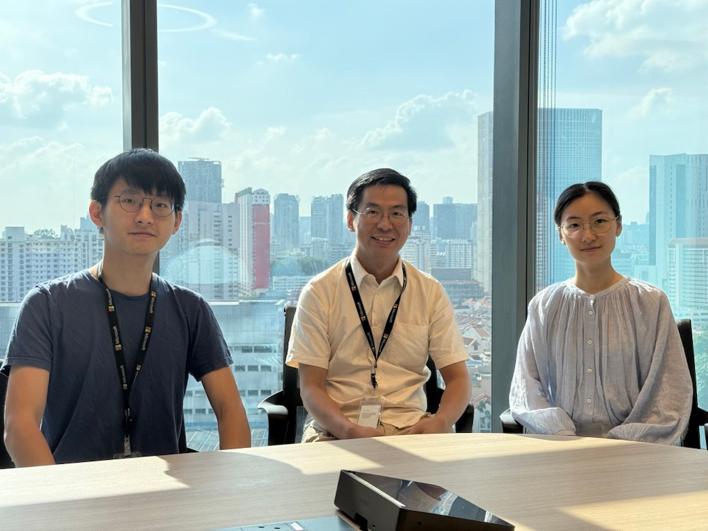 Xingxing Xu (center) with colleagues at Microsoft Research Asia - Singapore