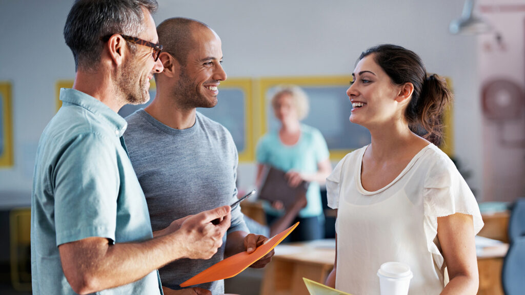 LINGUA Open Call | photo of three people talking with a fourth in the background
