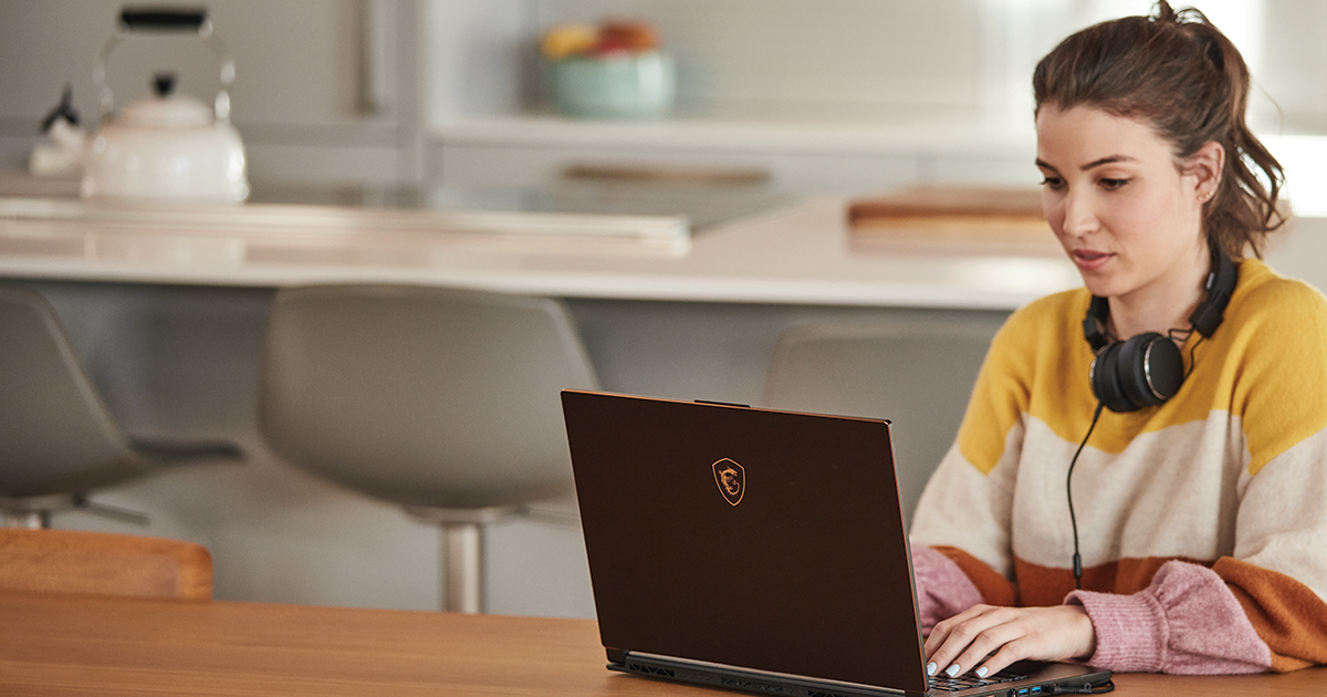 Image of a worker at her desk at home.