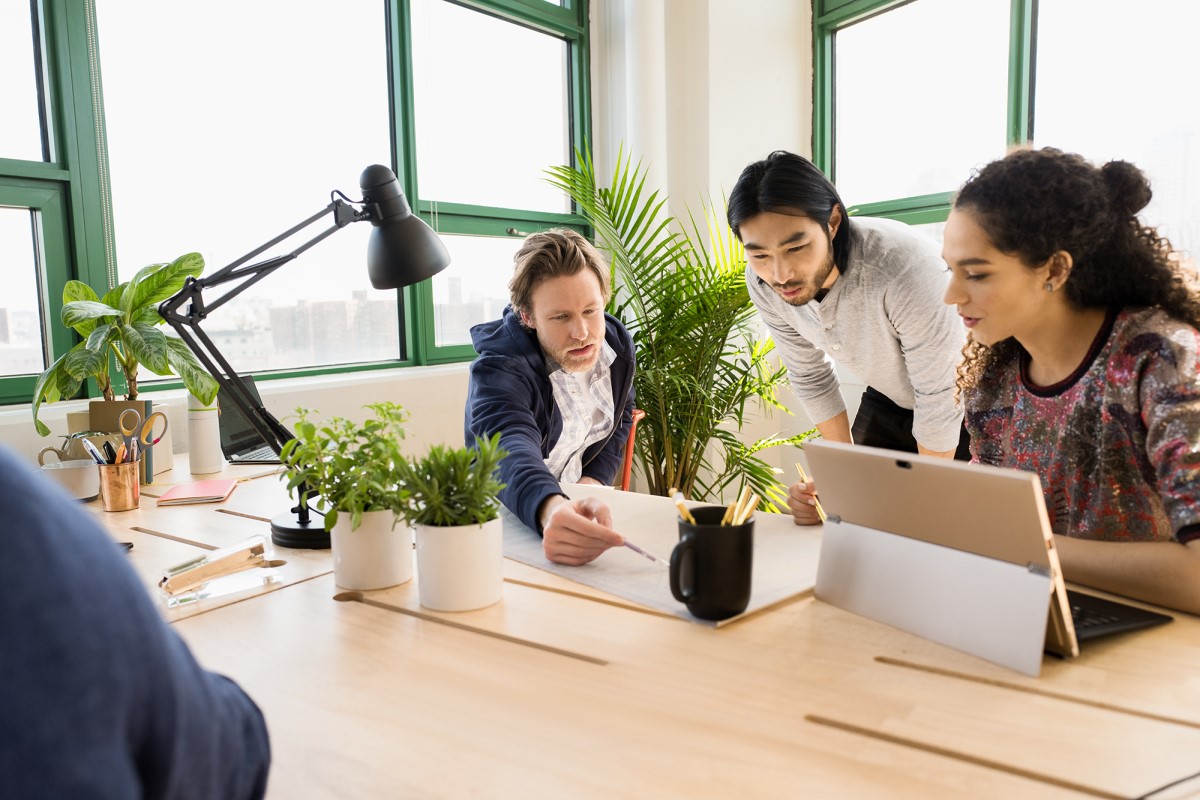 Small business team collaborating in modern workplace.