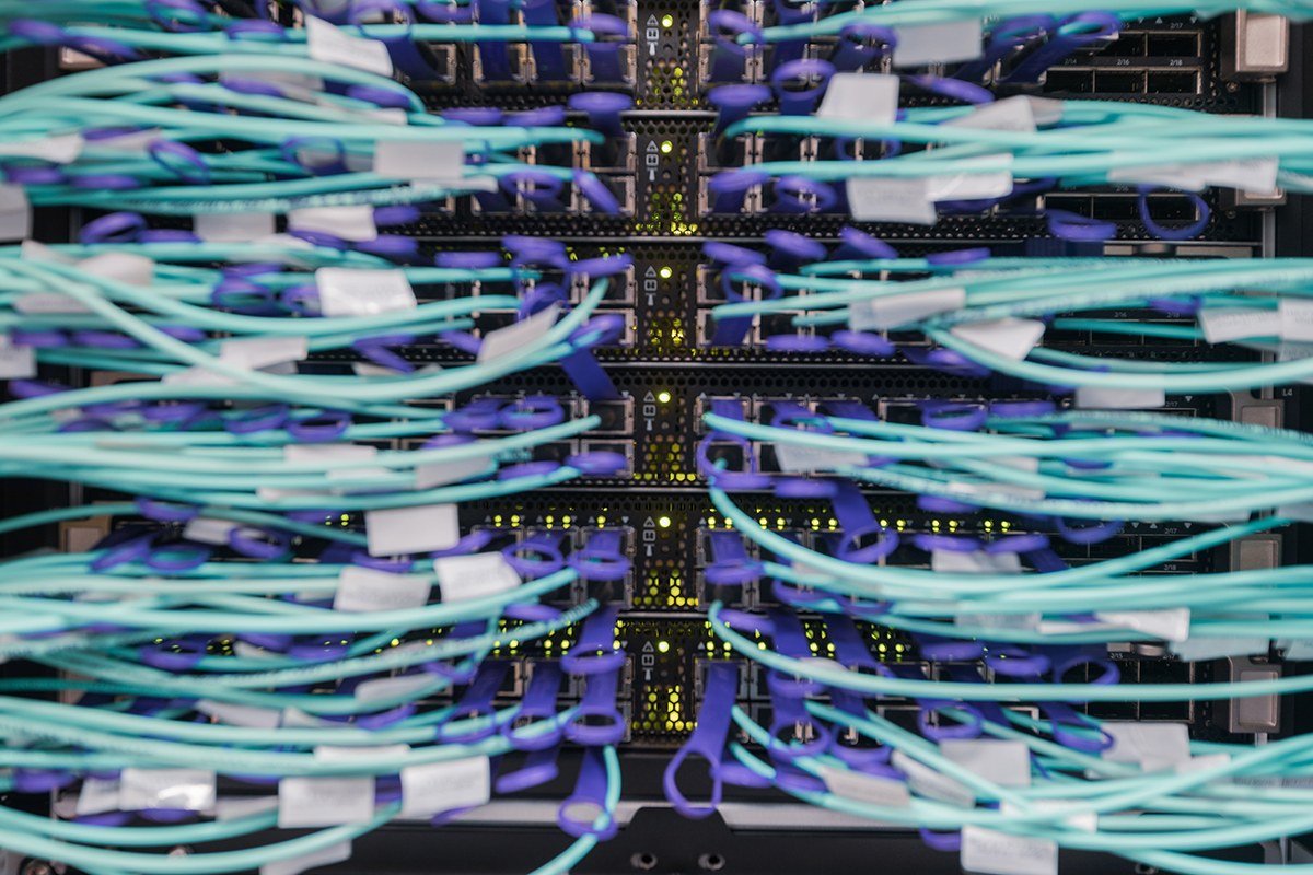 Cable cords plugged into a middle of row switch configuration