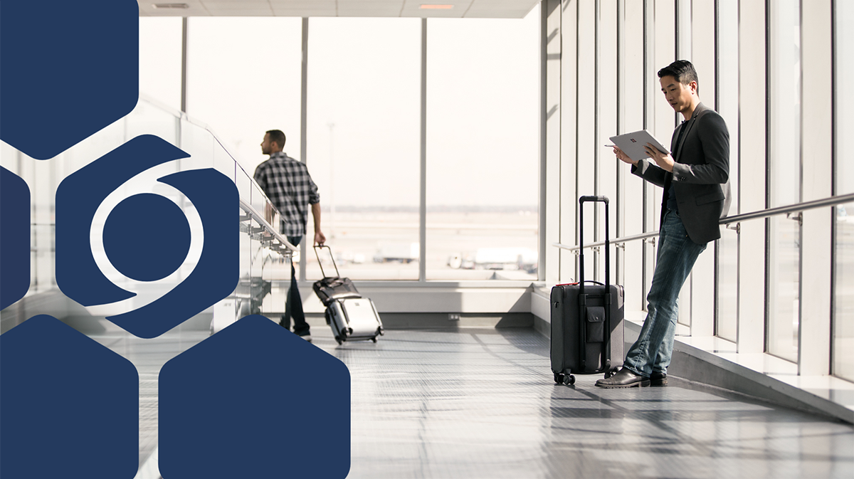 Photo of a man holding a tablet and luggage with blue hexagons and the icon for Storm threat actors
