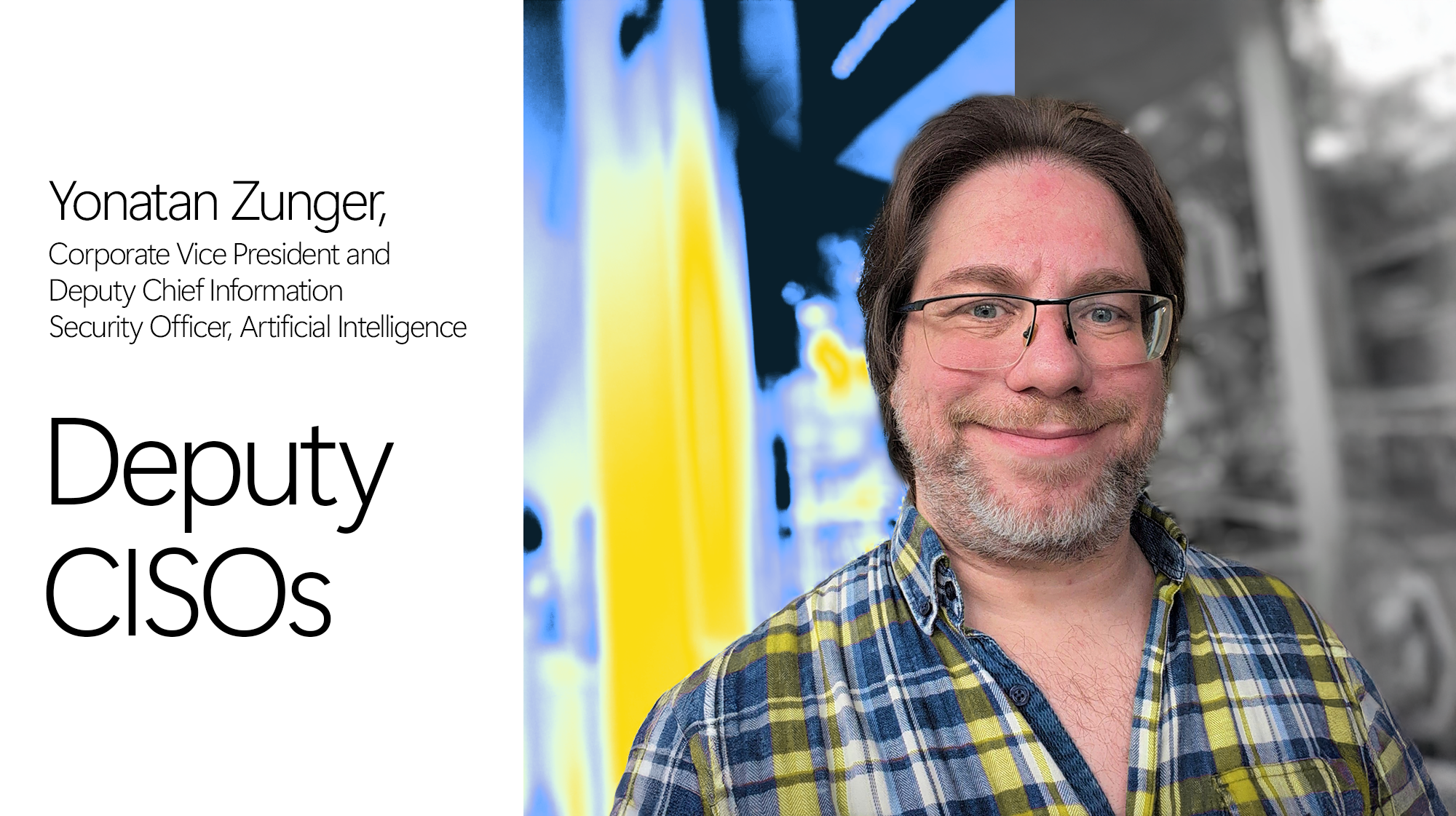 A man wearing glasses and a plaid shirt