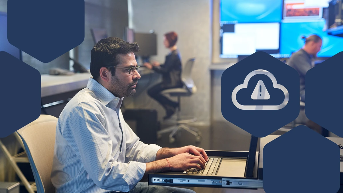 Photo of a SOC analyst working on a server