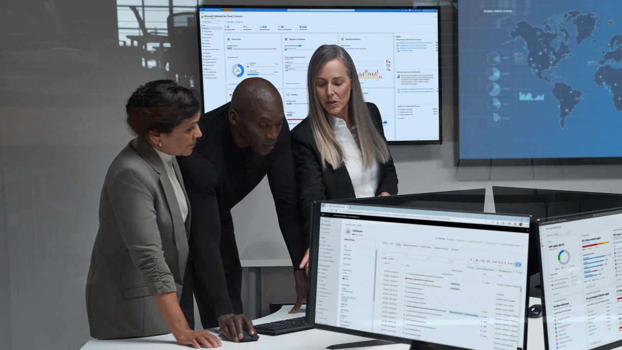 CISO (chief information security officer) collaborating with practitioners in a security operations center.