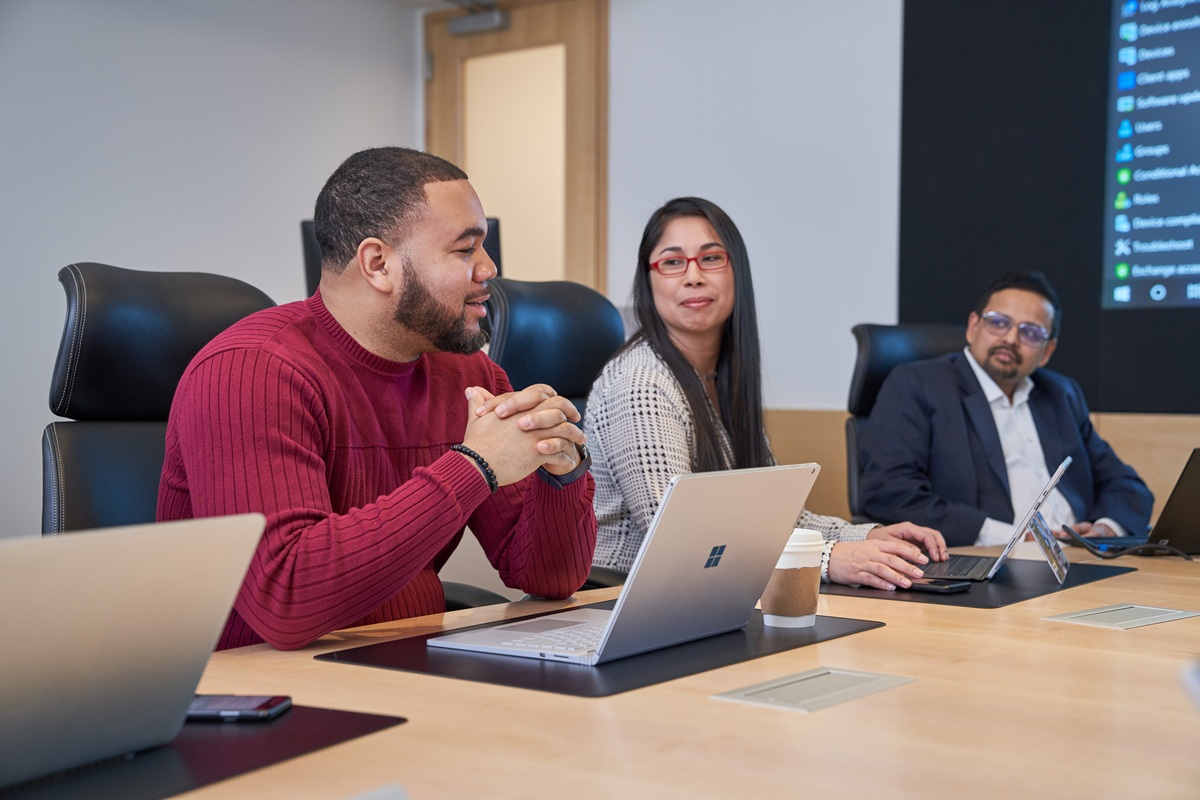 People sitting in a conference room.