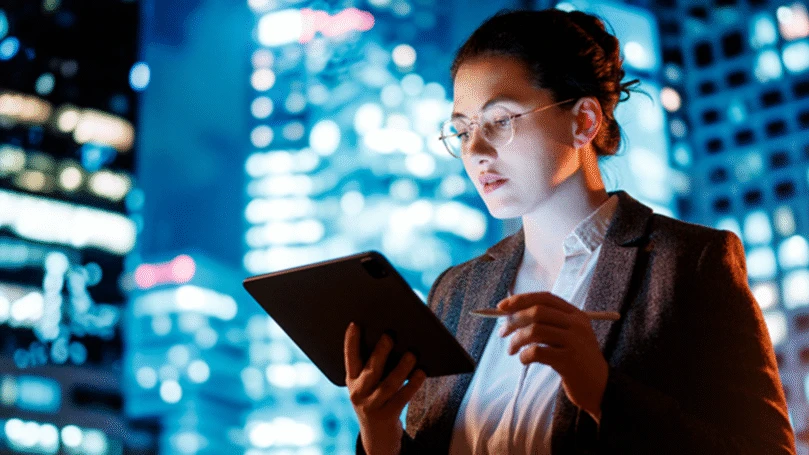 A woman holding a tablet computer.