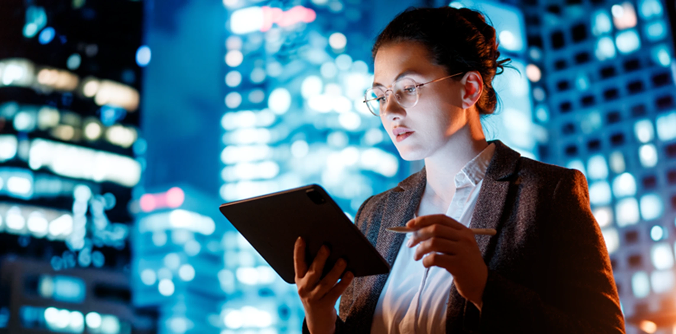 A woman holding a tablet computer.