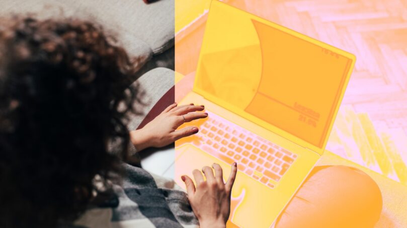 A person typing on a laptop.