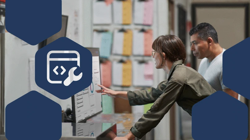 Photo of CEO and COO at a manufacturing company reviewing security reports.