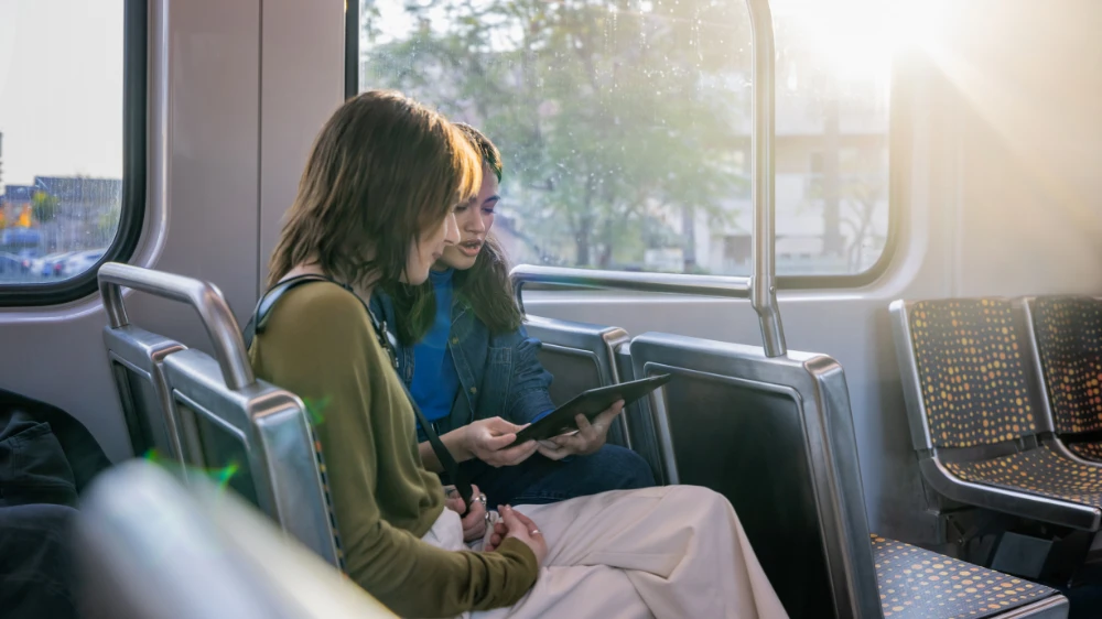 Students in focused work on the bus.