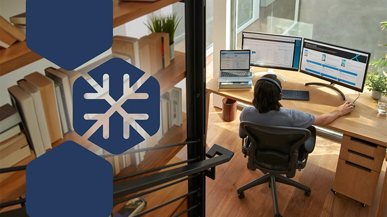 Photo of a person working in a home office, with the Blizzard actor icon in overlay