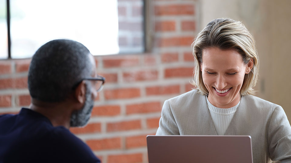 A pair of coworkers in an office environment
