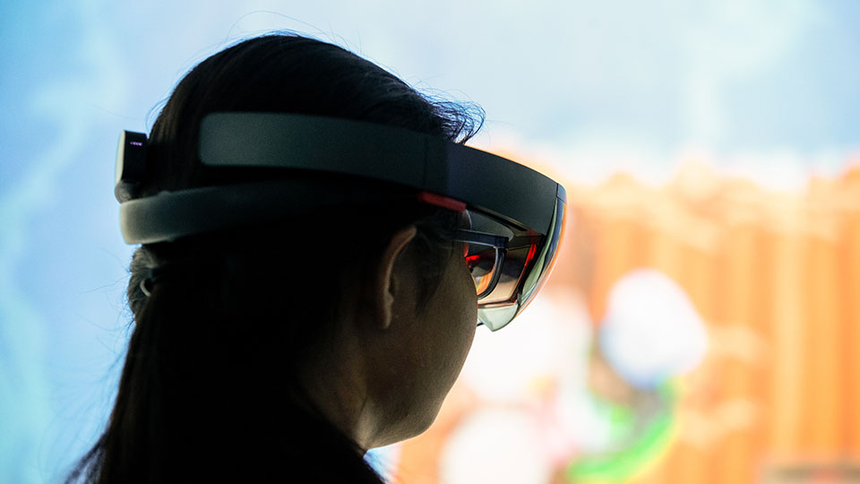 A woman wears a virtual reality headset