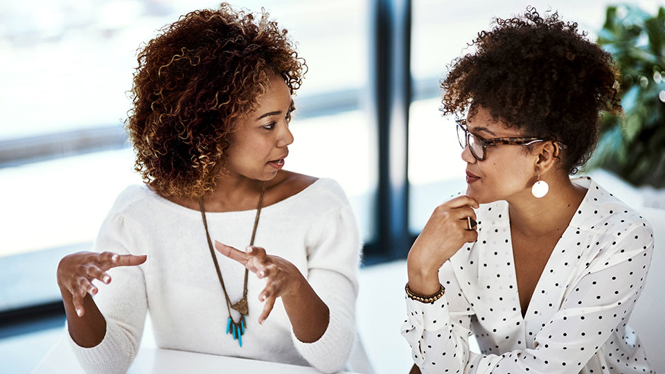 Two women engaged in conversation
