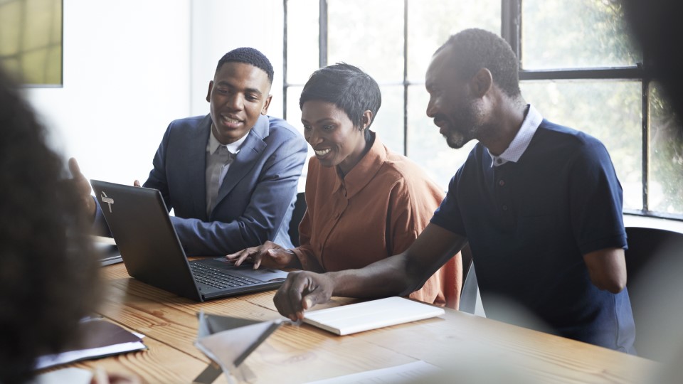 People sitting around an office table.