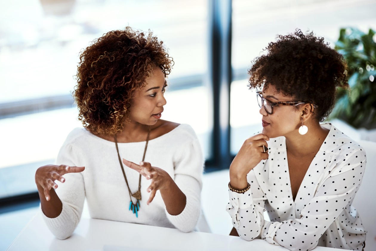 Shot of two young designers working in an modern office.