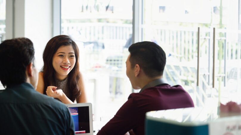 Young business executives sharing ideas.