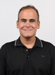 Gonis smiles for a corporate photo.