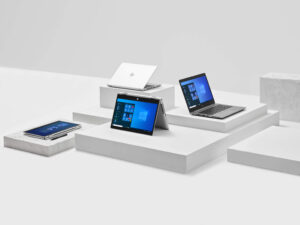 Several Windows laptops are displayed on a set of display boxes.