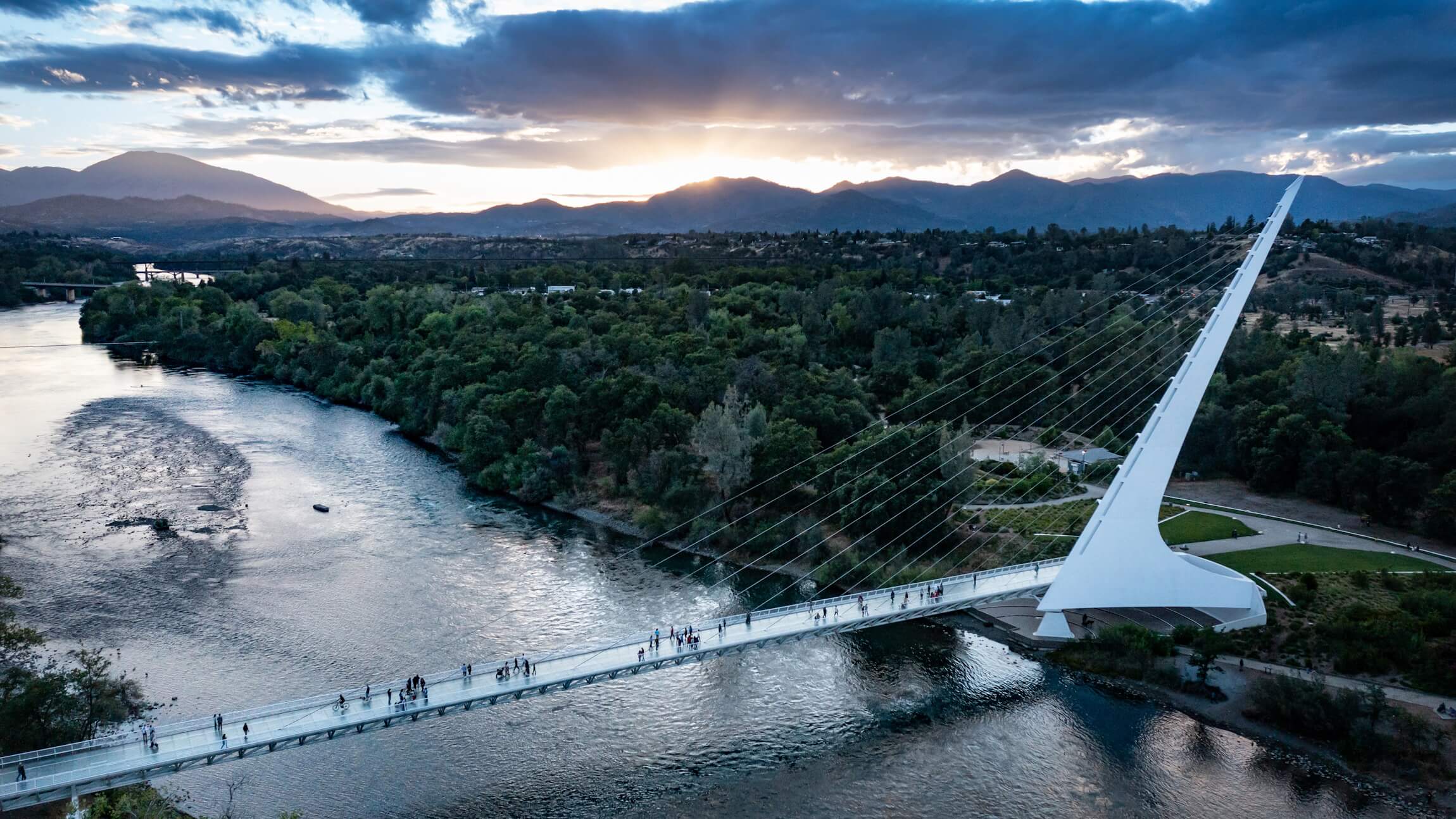 A pedestrian bridge spanning a river.