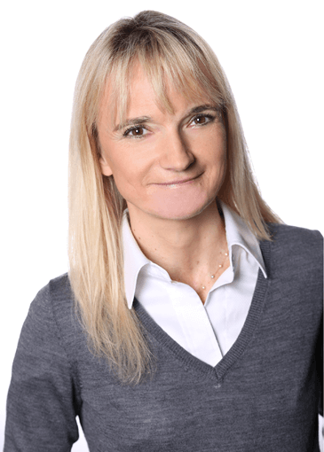 D’Hers smiles in corporate photo. 