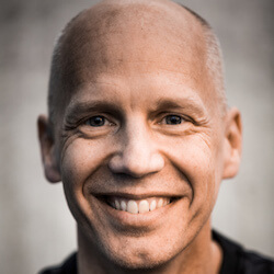 Koenigsbauer is shown smiling in a profile photo.