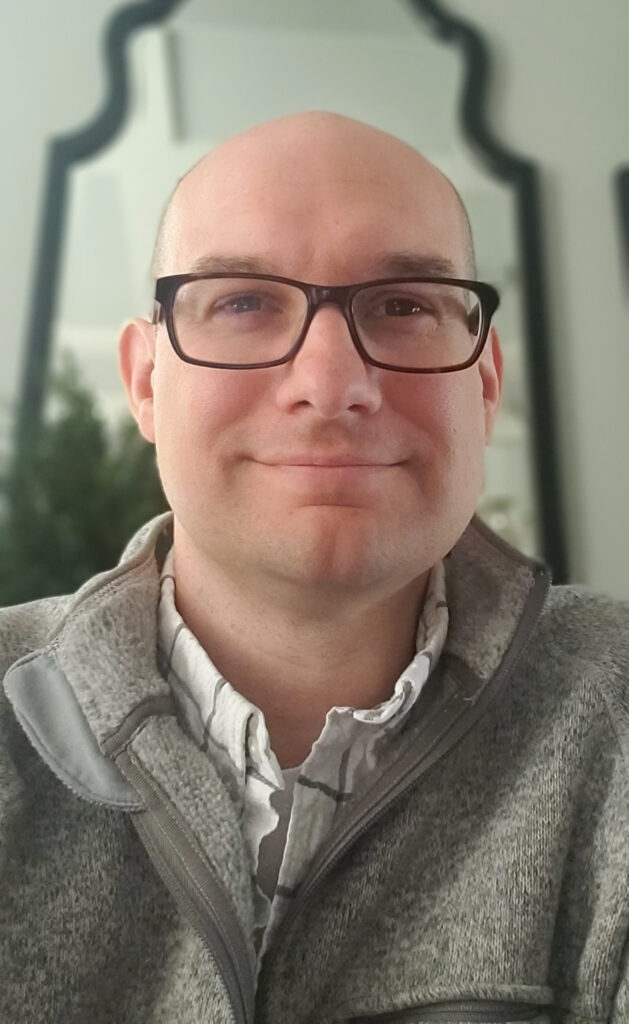 Gray smiles in a portrait photo.