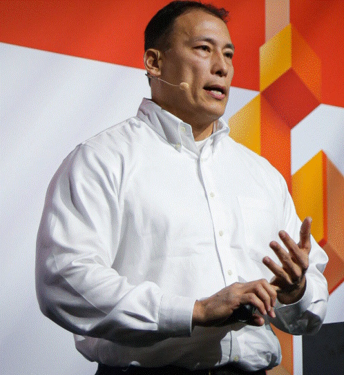 Fielder speaks on stage at a conference.