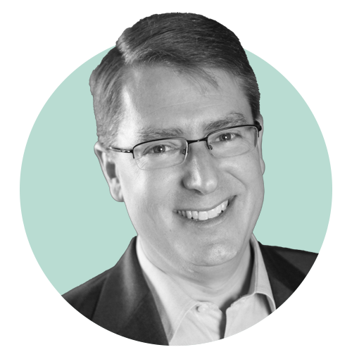 Osten smiles in a portrait photo.