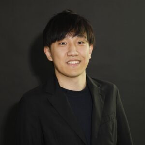 A man in a black suit