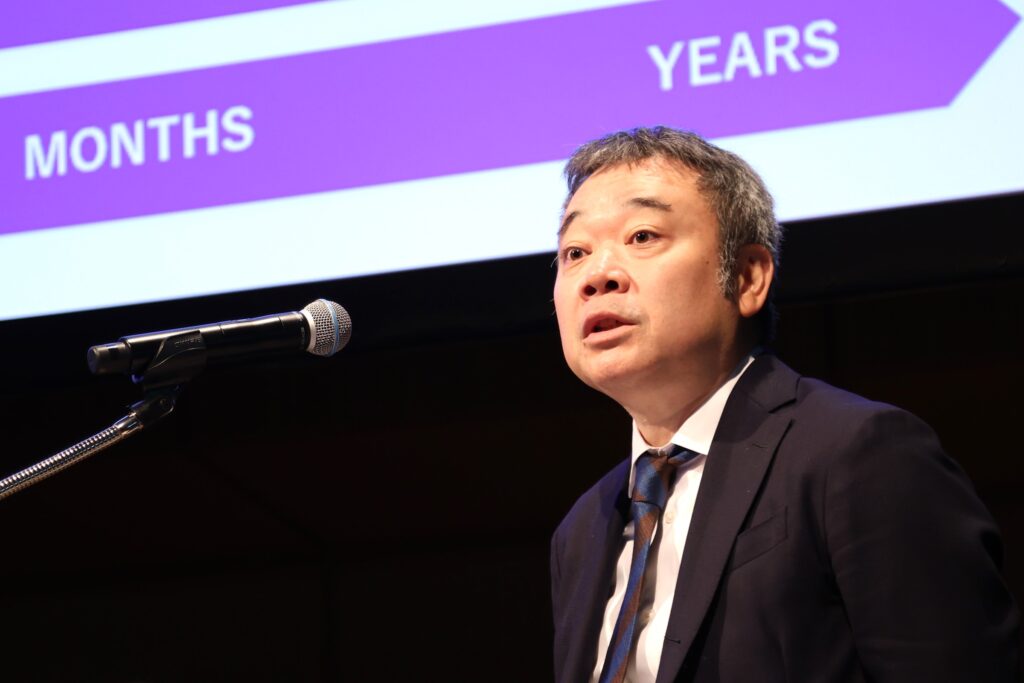 a man speaking into a microphone