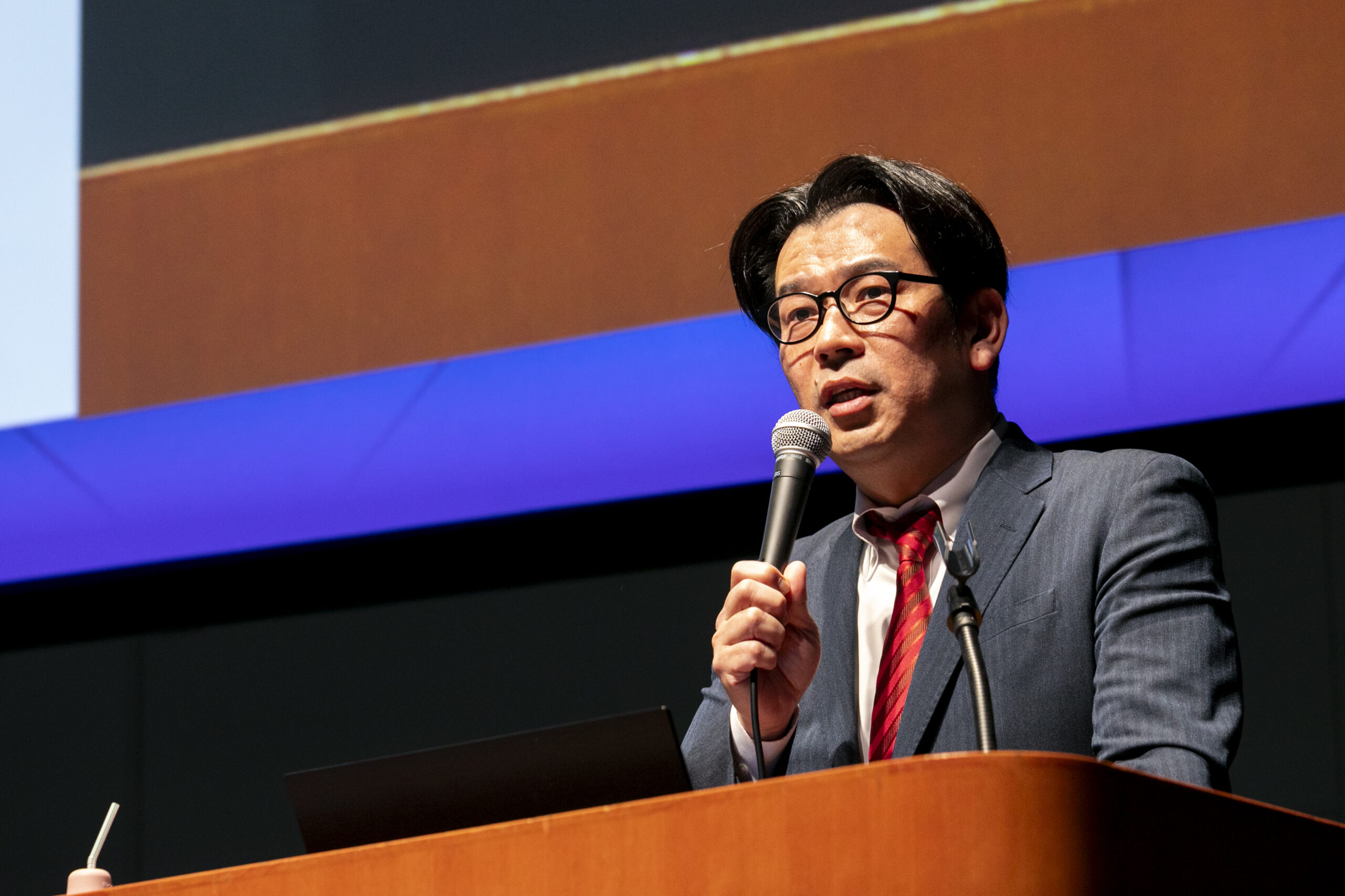A man speaking into a microphone