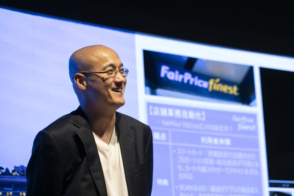 A man in a suit smiling