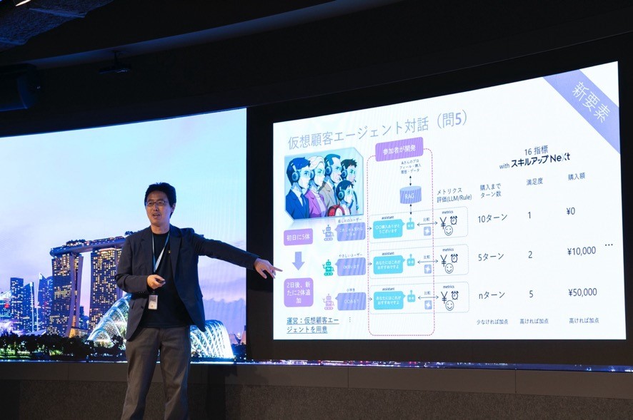 A man standing in front of a large screen